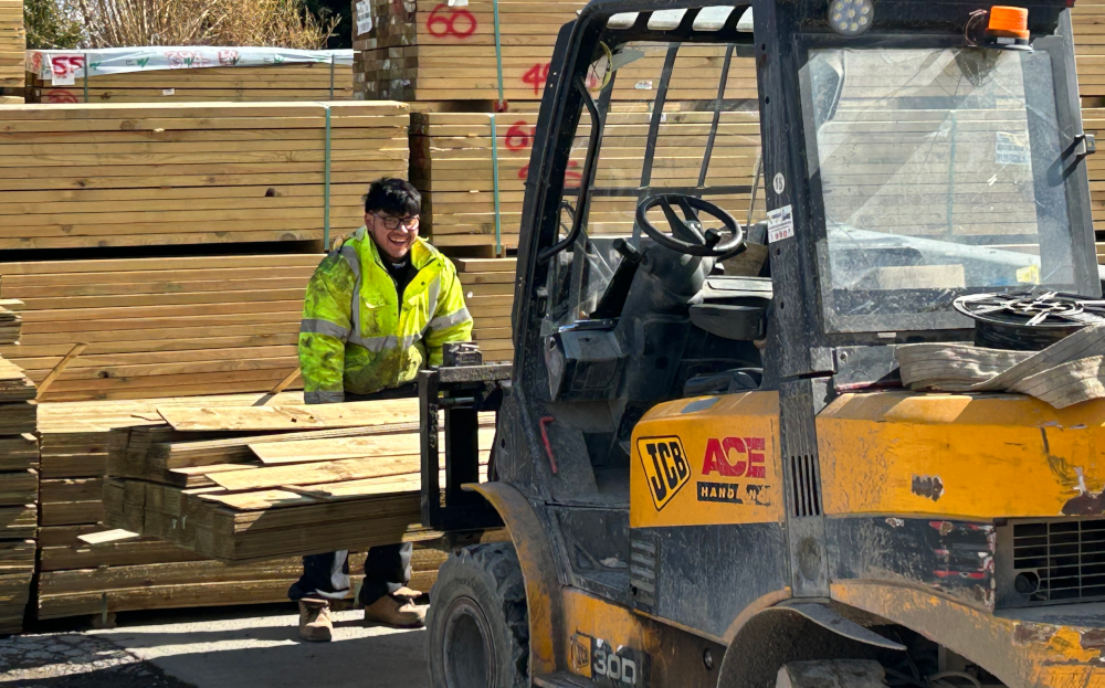 yellow forklift and smiles all round